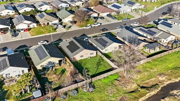an aerial view of residential houses with outdoor space