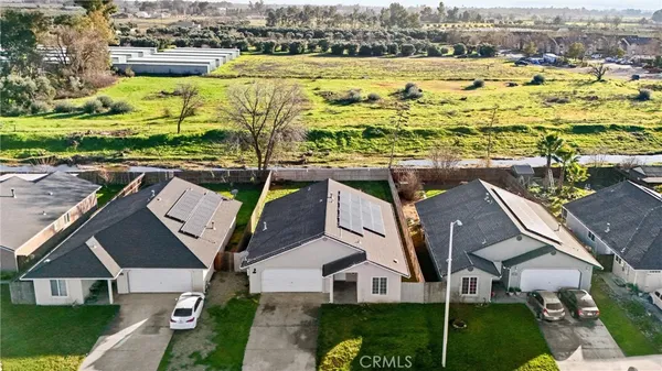 an aerial view of residential building and ocean