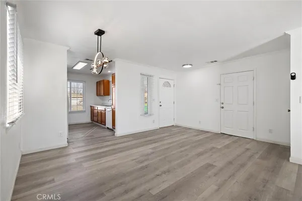 a view of a kitchen with a sink and dishwasher wooden floor