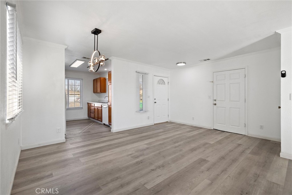 2067 Blossom Avenue Corning, CA 96021 - Photo 4 of 37 a view of a kitchen with a sink and dishwasher wooden floor