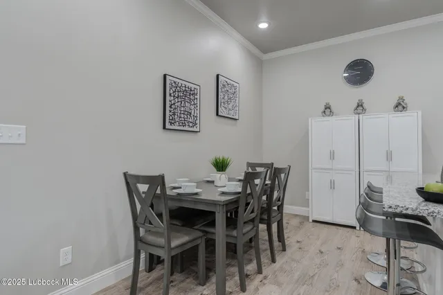 a view of a dining room with furniture and a table