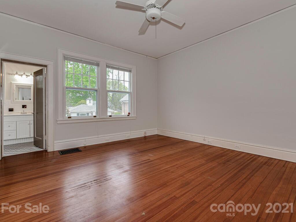 1600 Queens Road Charlotte, NC 28207 - Photo 14 of 30 wooden floor in an empty room with a window