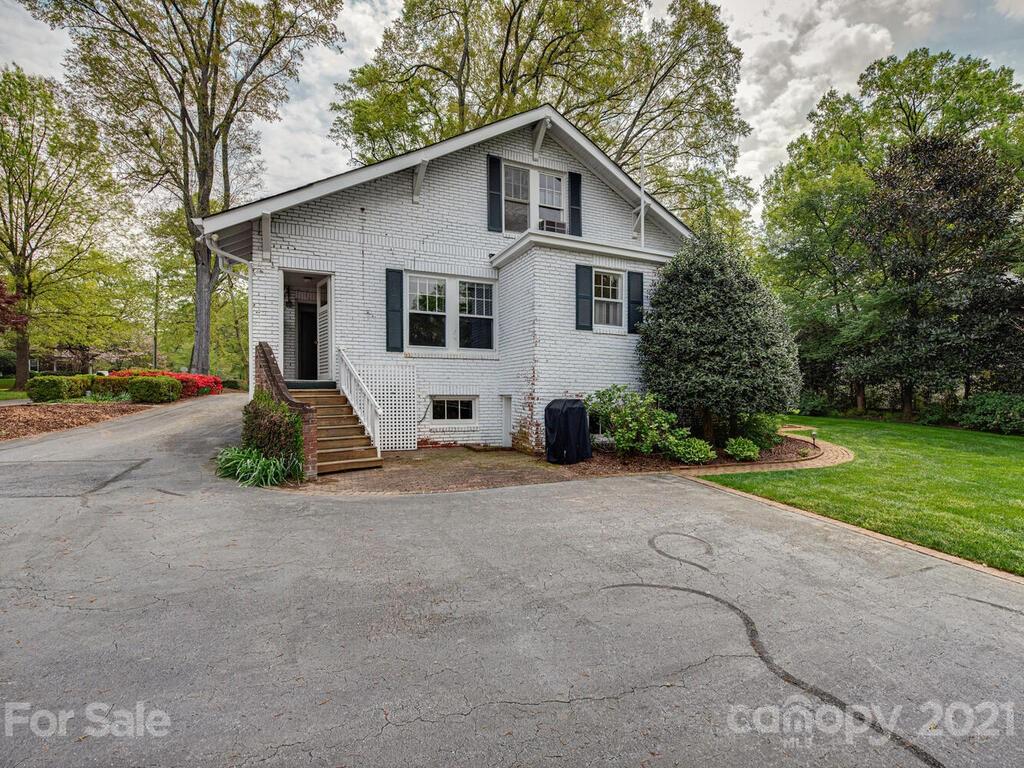 1600 Queens Road Charlotte, NC 28207 - Photo 17 of 30 a view of a house with backyard and trees