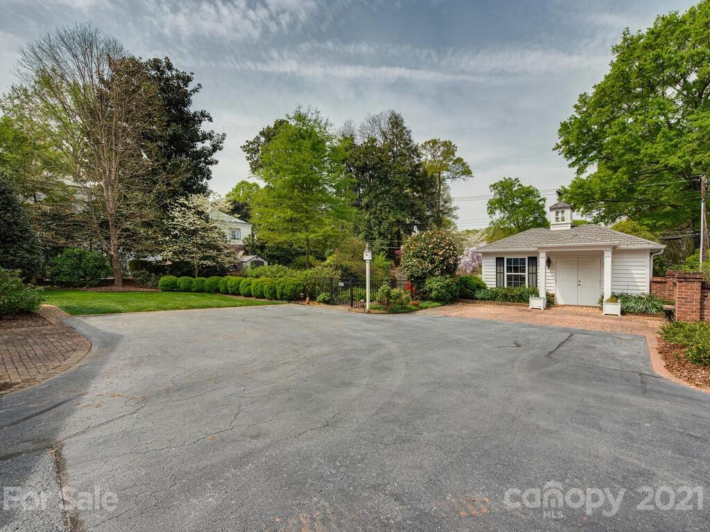 1600 Queens Road Charlotte, NC 28207 - Photo 20 of 30 a view of a house with a yard and a garage