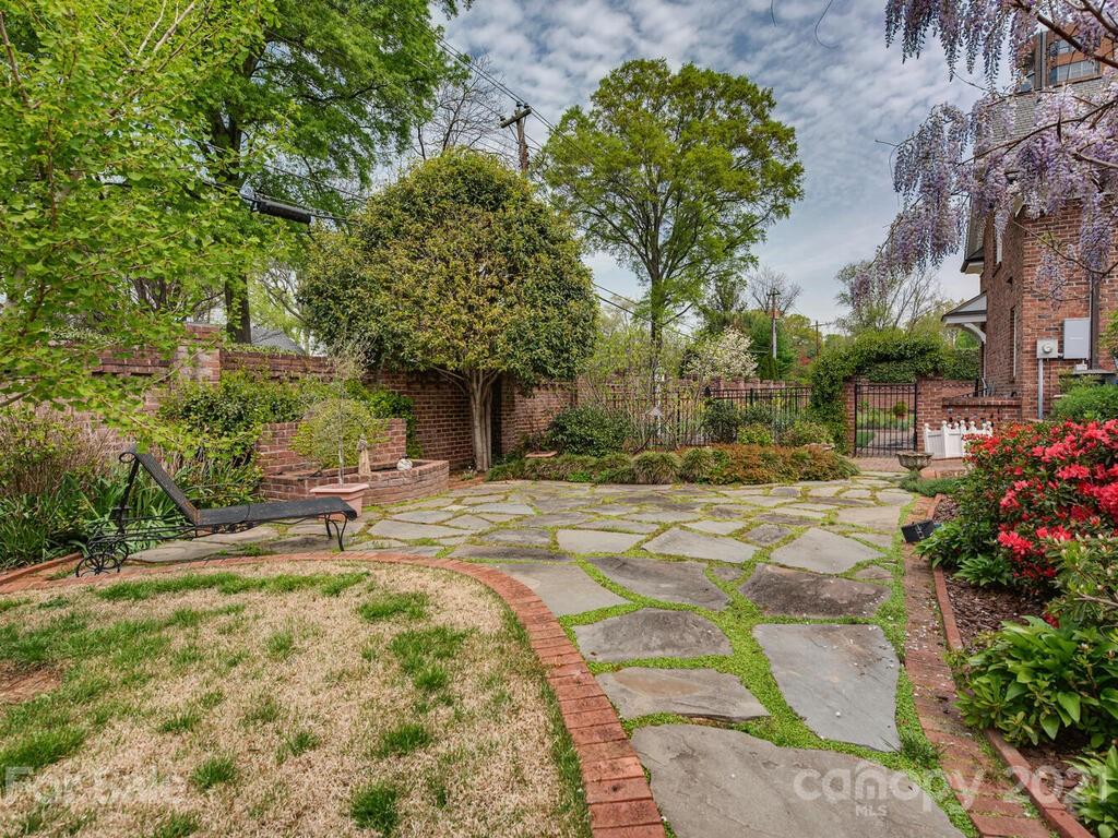 1600 Queens Road Charlotte, NC 28207 - Photo 22 of 30 a front view of a house with a yard