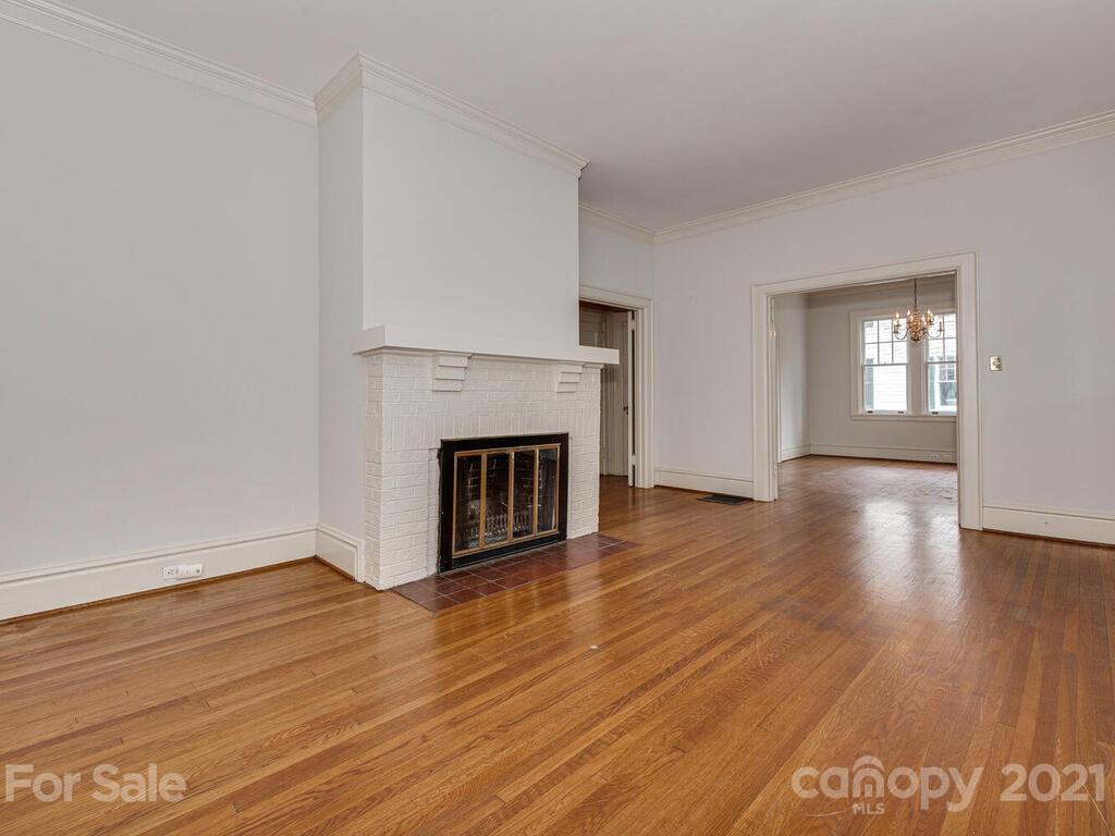 1600 Queens Road Charlotte, NC 28207 - Photo 10 of 30 a view of a livingroom with wooden floor and a fireplace