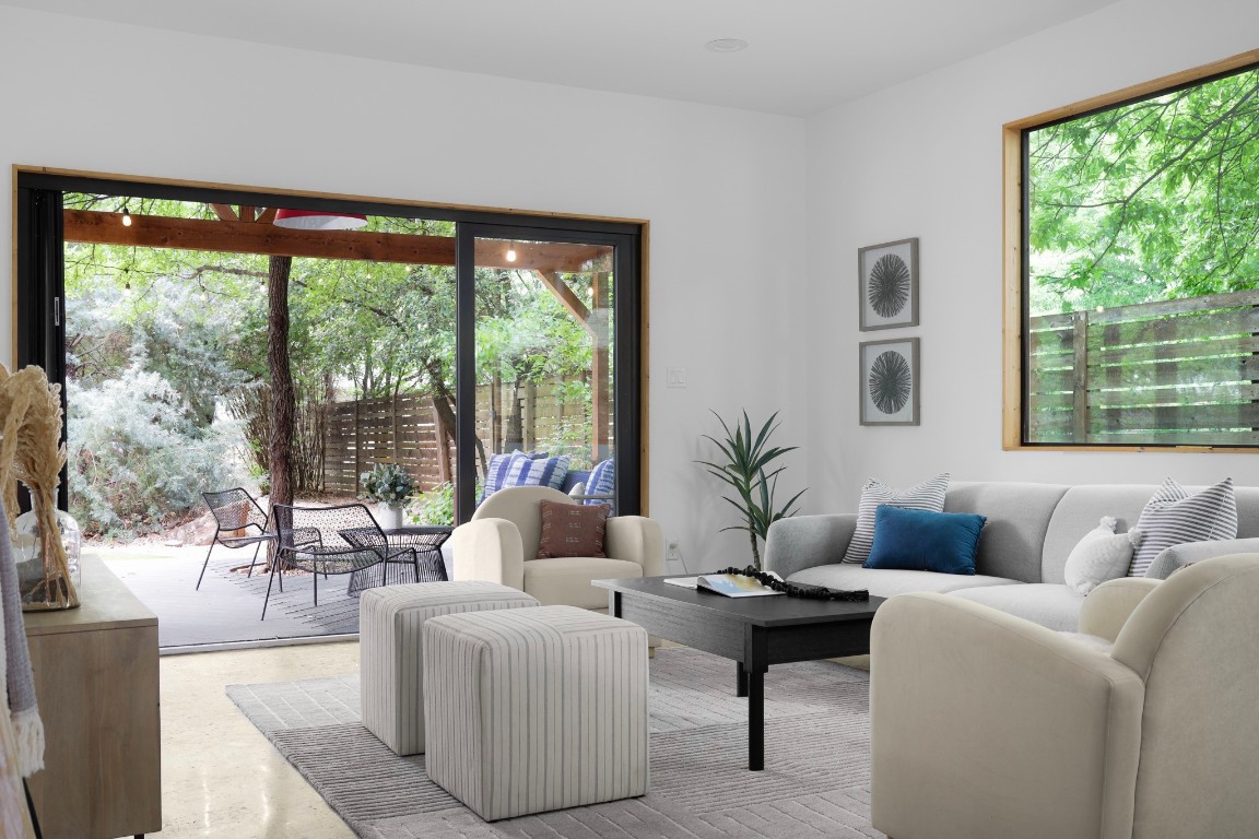 3208 Lyons Road Austin, TX 78702 - Photo 1 of 1 a living room with furniture and a large window