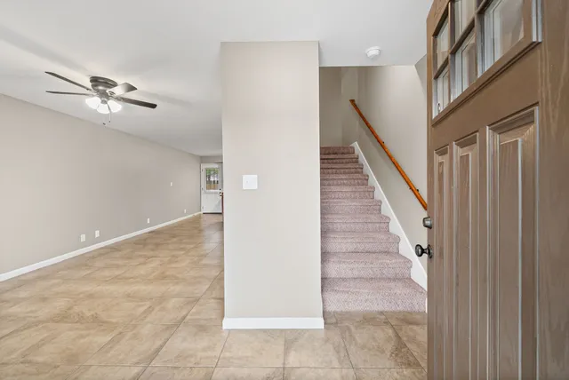 a view of a hallway with staircase