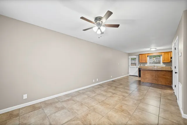 a view of a kitchen with a sink and cabinets