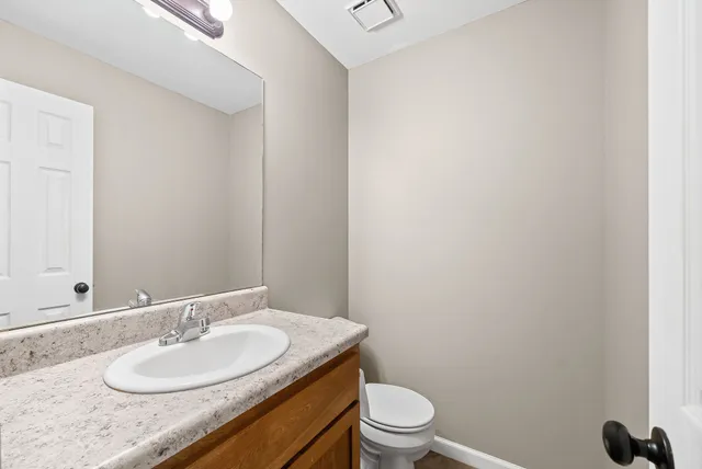 a kitchen with stainless steel appliances granite countertop a stove and a refrigerator