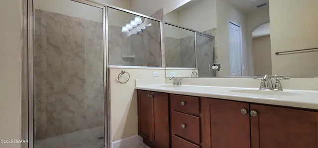 a bathroom with a sink and mirror