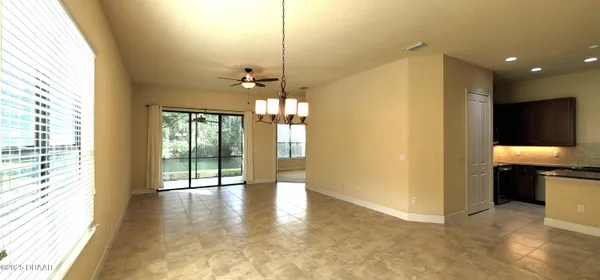 a view of a hallway with a chandelier