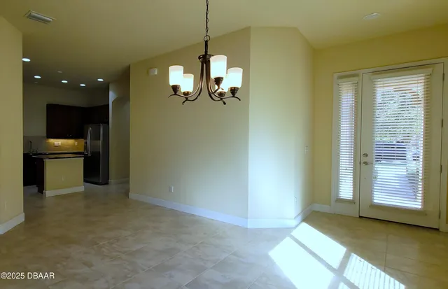 a view of a kitchen and a window in the room