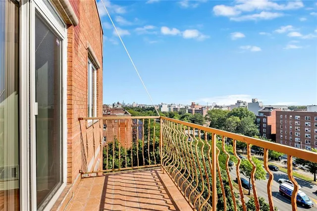 a view of balcony with wooden floor