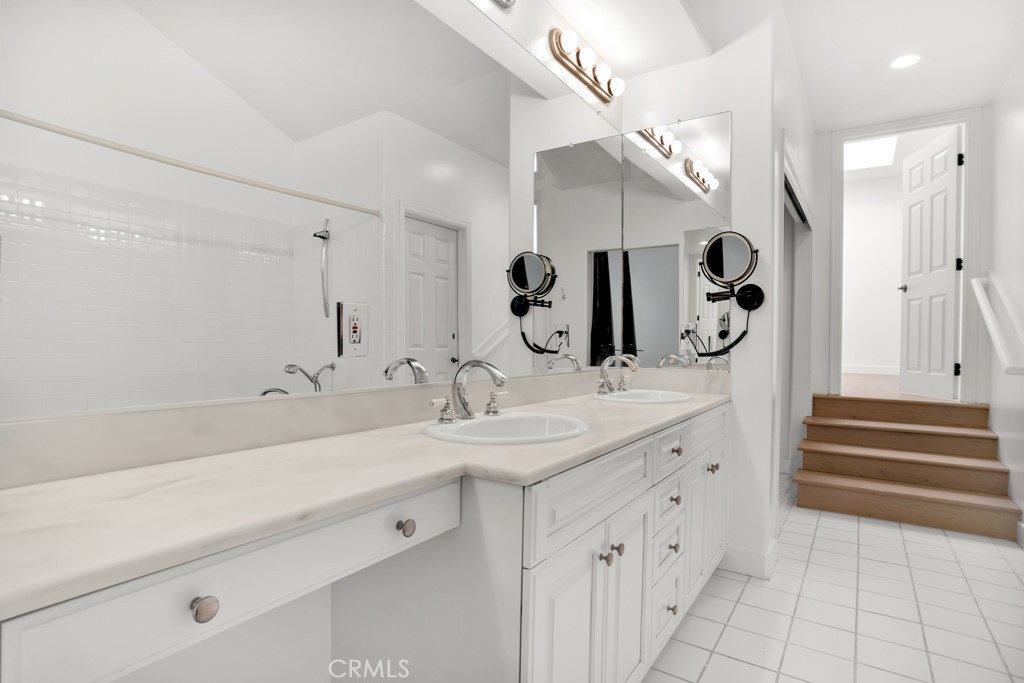 6435 Zumirez Drive, Unit 2 Malibu, CA 90265 - Photo 16 of 32 a bathroom with a sink and a mirror