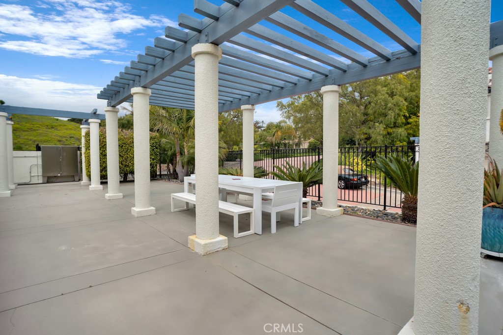 6435 Zumirez Drive, Unit 2 Malibu, CA 90265 - Photo 31 of 32 a outdoor space with lots of furniture and glass door