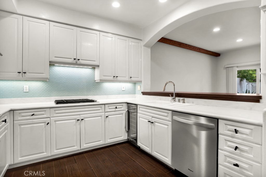 6435 Zumirez Drive, Unit 2 Malibu, CA 90265 - Photo 4 of 32 a kitchen with white cabinets and sink