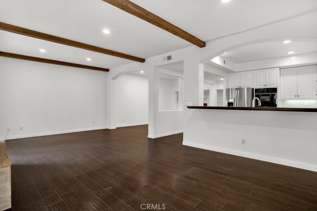 6435 Zumirez Drive, Unit 2 Malibu, CA 90265 - Photo 9 of 32 a view of a kitchen with stainless steel appliances granite countertop a refrigerator a sink and a stove