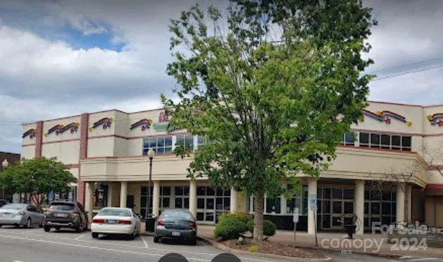 a view of a car parked in front of a building