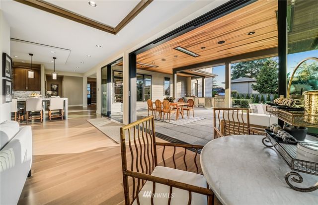 a view of a dining room with furniture wooden floor and chandelier