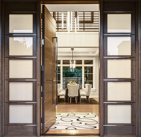 a view of a room with wooden floor and a window