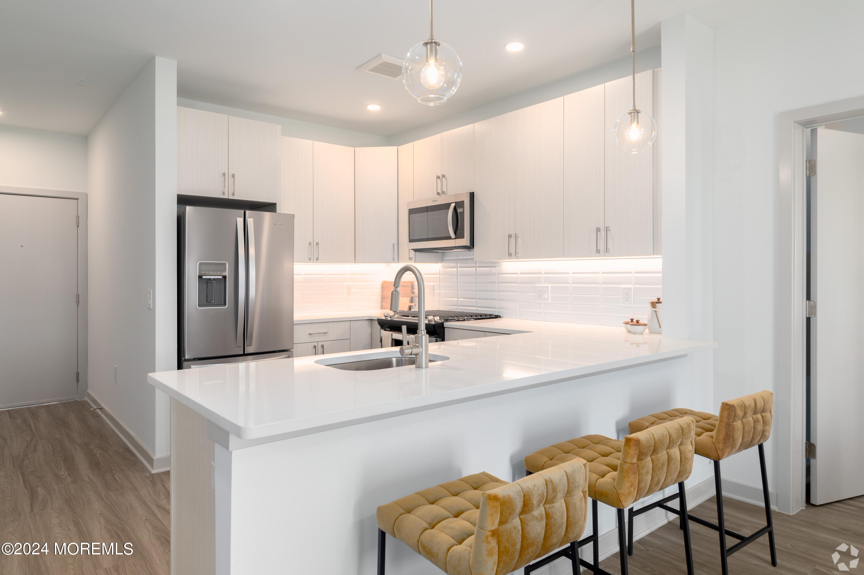 6461 Highway 9, Unit #433 Howell, NJ 07731 - Photo 17 of 29 a kitchen with stainless steel appliances granite countertop a sink and refrigerator