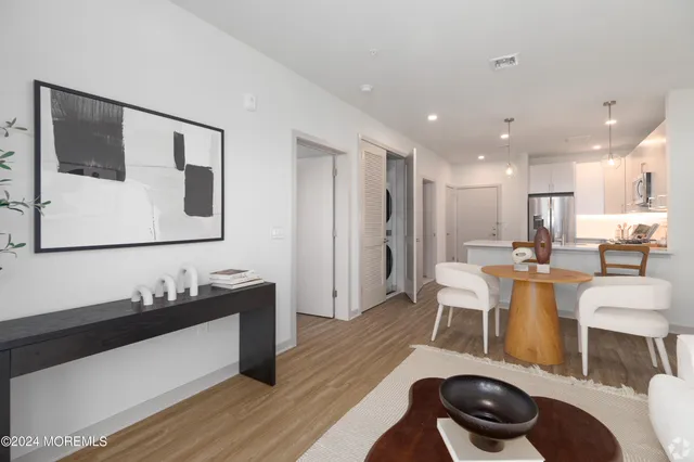 a large bed sitting in a bedroom next to a window