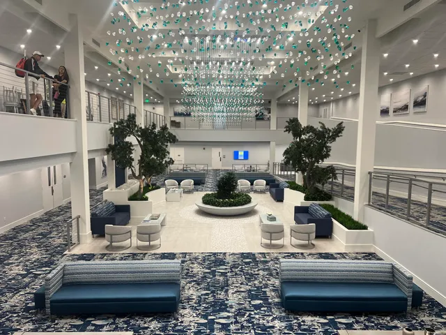 a view of a kitchen with stainless steel appliances granite countertop a stove and a sink