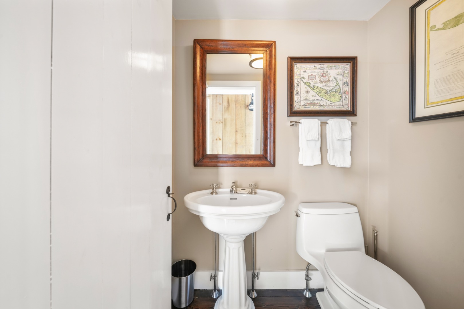 21 Quidnet Road Nantucket, MA 02554 - Photo 21 of 62 a bathroom with a toilet sink and mirror