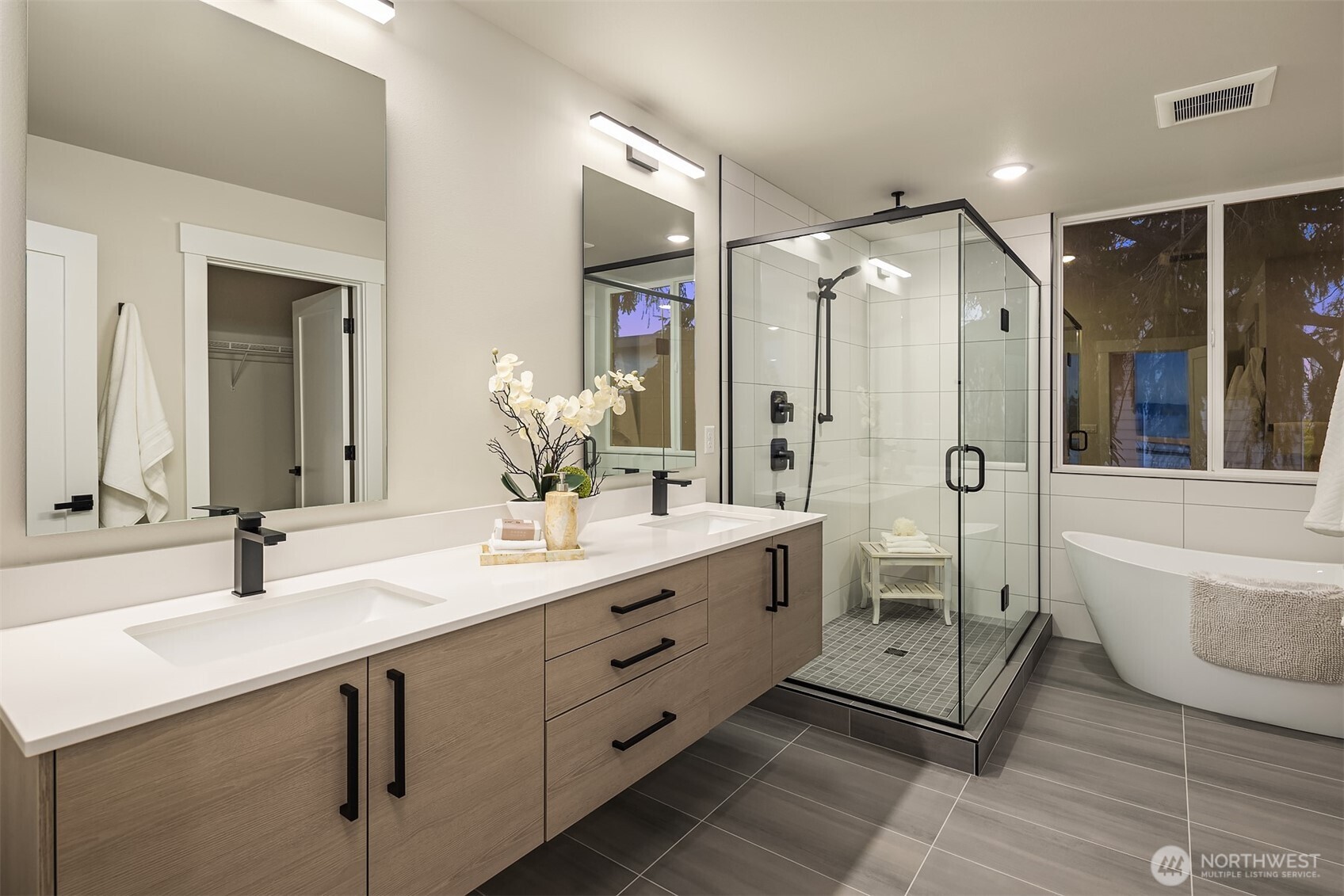 1313 14th Avenue South, Unit B Seattle, WA 98144 - Photo 16 of 30 a spacious bathroom with double vanity sink a shower and a mirror
