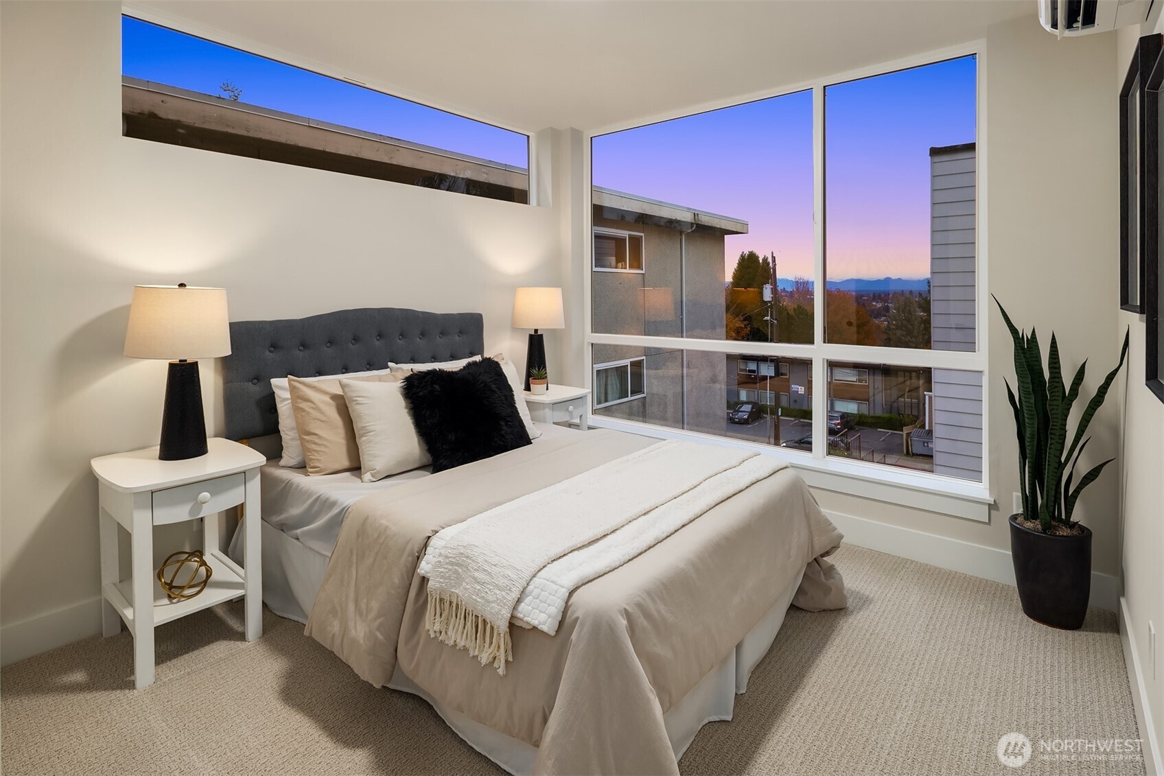 1313 14th Avenue South, Unit B Seattle, WA 98144 - Photo 22 of 30 a bedroom with a bed and a potted plant