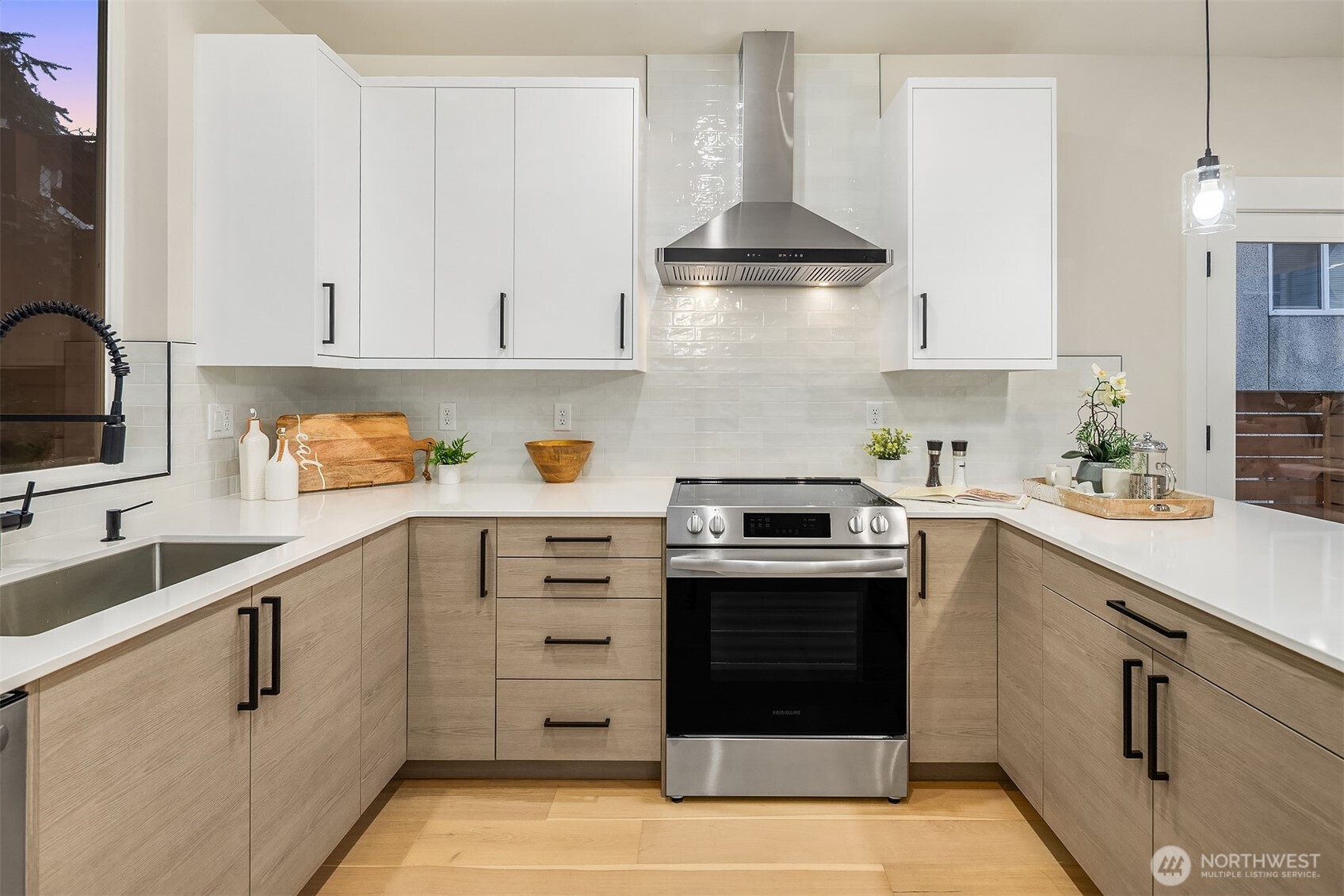1313 14th Avenue South, Unit B Seattle, WA 98144 - Photo 9 of 30 a kitchen with granite countertop a sink stainless steel appliances and cabinets