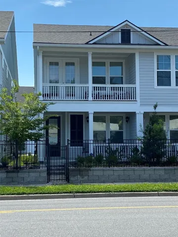 a view of a house with a small yard and plants