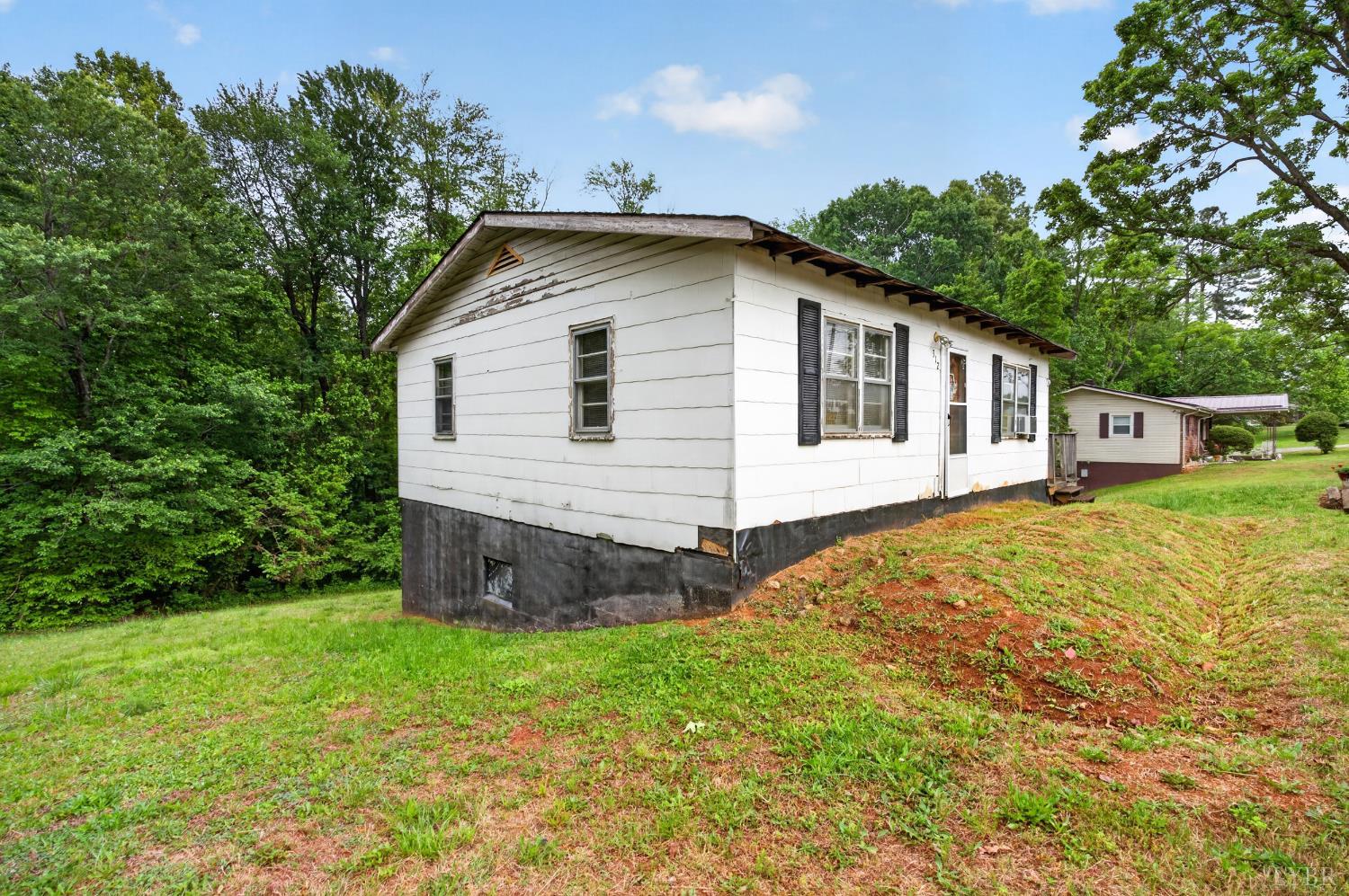 312 Cheney Lane Gretna, VA 24557 - Photo 13 of 16 a view of a house with a yard and sitting area