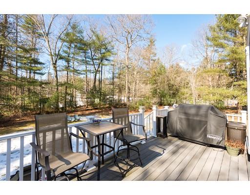 489 Spring Street Hanson, MA 02341 - Photo 24 of 27 a balcony with table and chairs