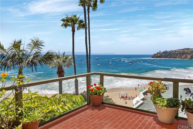 a living room filled with furniture and a table