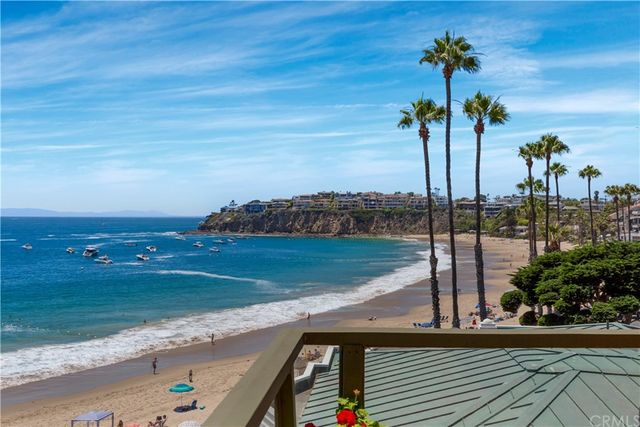 a view of a house with sitting area and garden