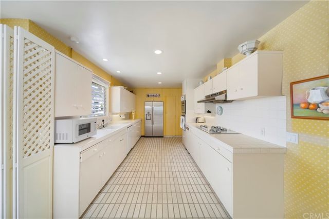 a spacious bedroom with a bed and a window