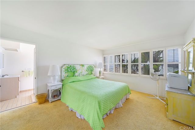 a view of a dining room with furniture and a window