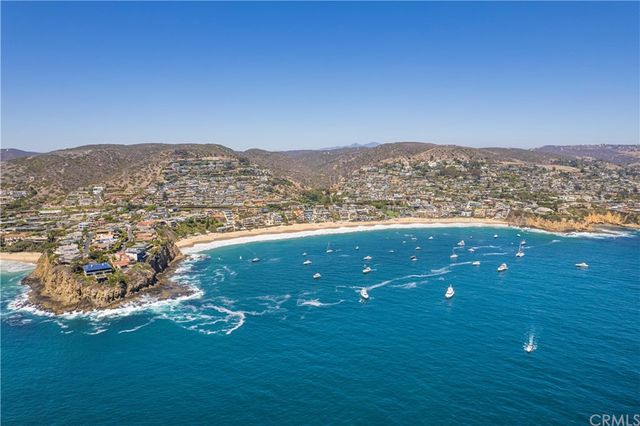 a view of a chairs and table in patio with a fire pit