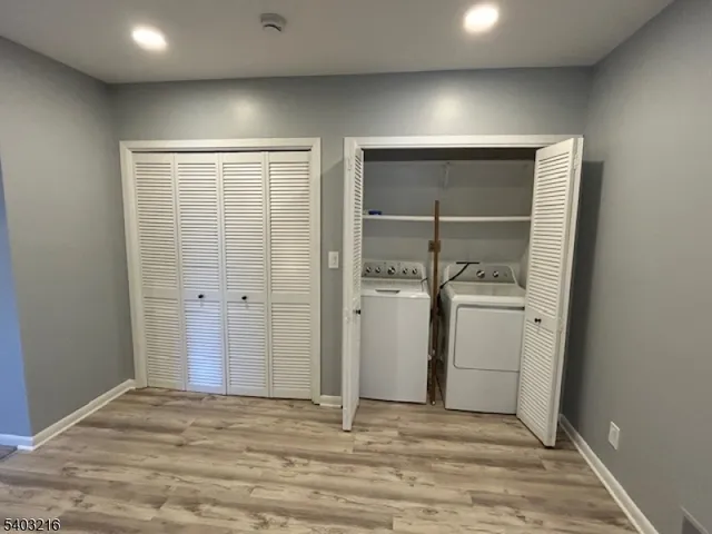 a view of storage and utility room with closet