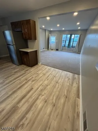 a large room with a bed and glass door