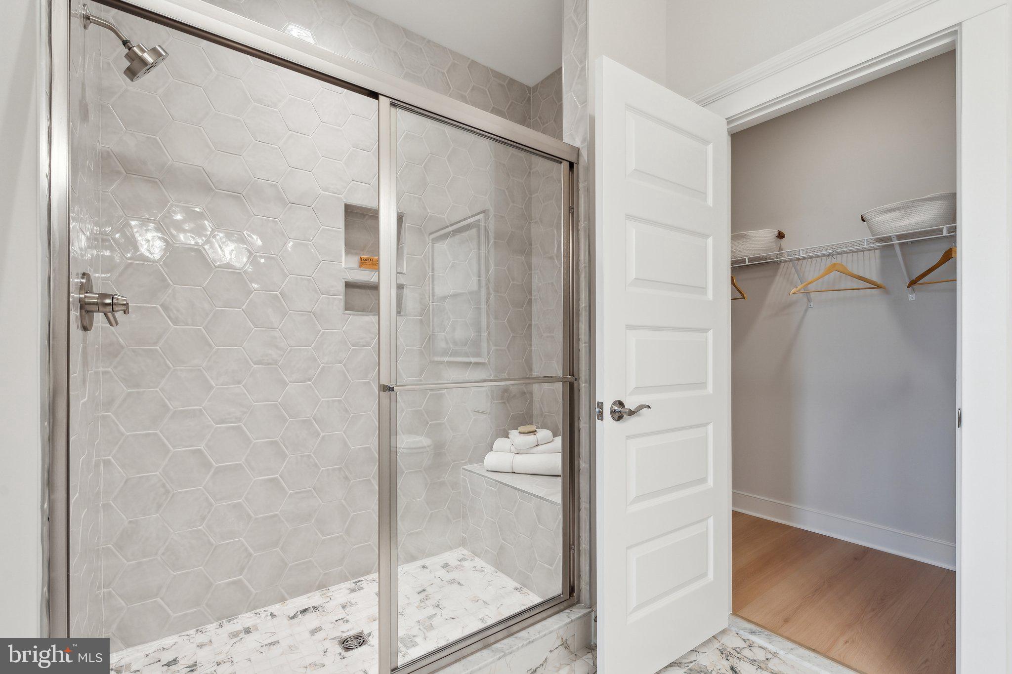 410 Granite Rdg Drive Winchester, VA 22603 - Photo 17 of 27 a bathroom with a glass shower door