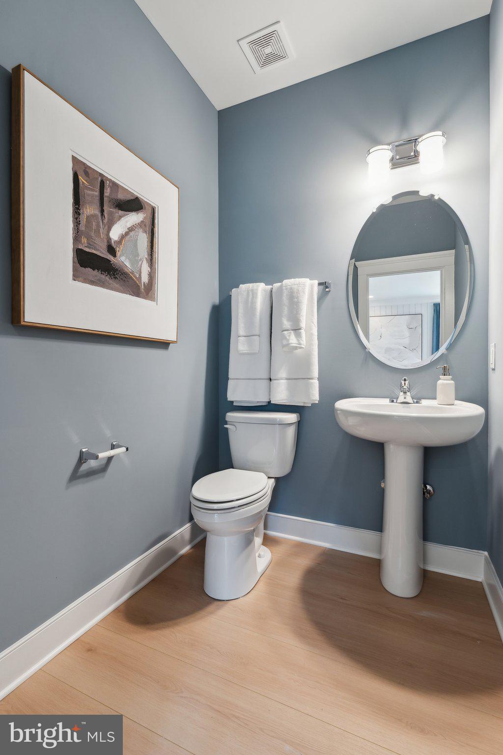 410 Granite Rdg Drive Winchester, VA 22603 - Photo 10 of 27 a bathroom with a toilet sink and mirror
