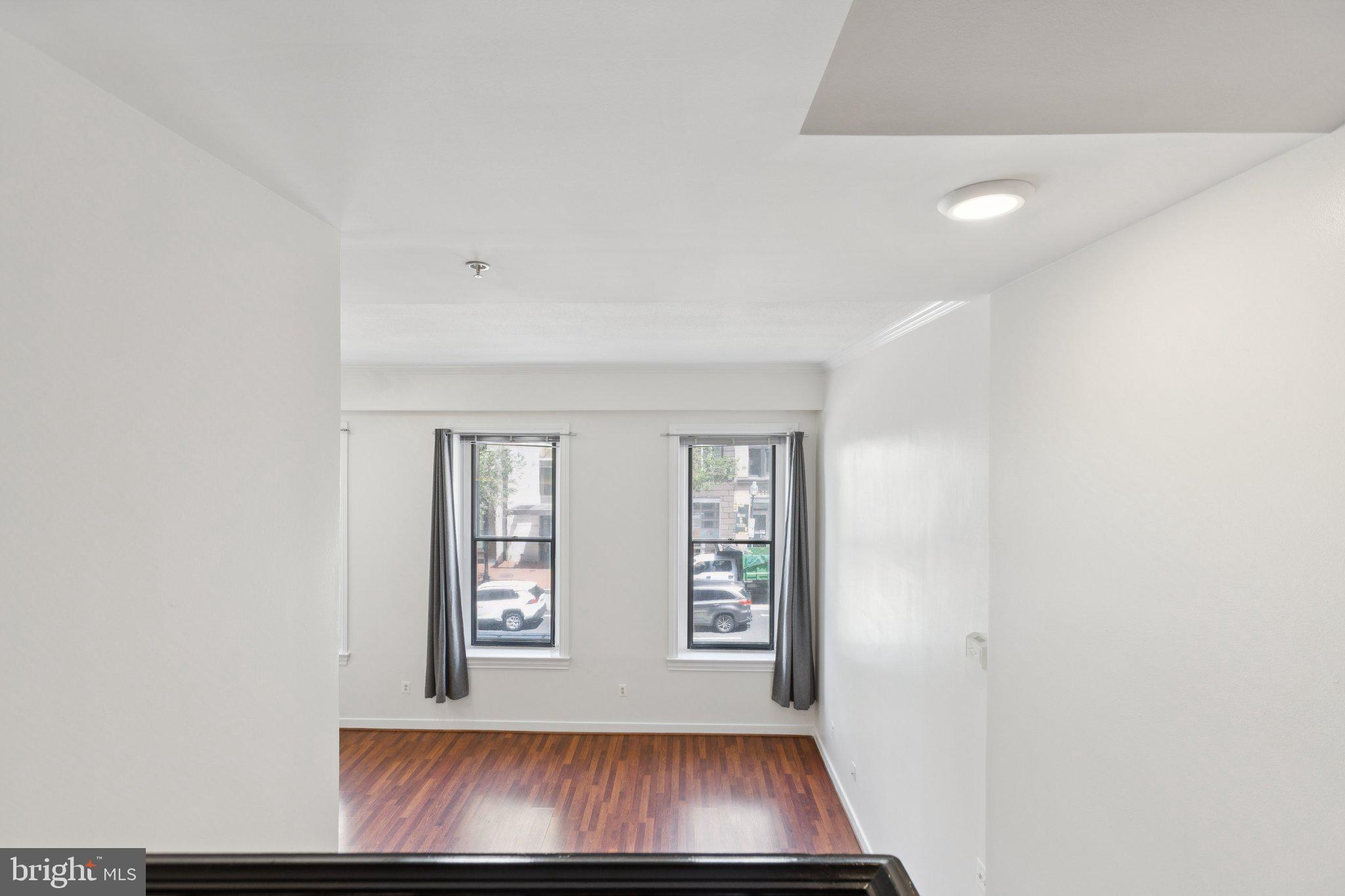 616 E Street Northwest, Unit 217 Washington, DC 20004 - Photo 18 of 73 a view of an empty room with windows