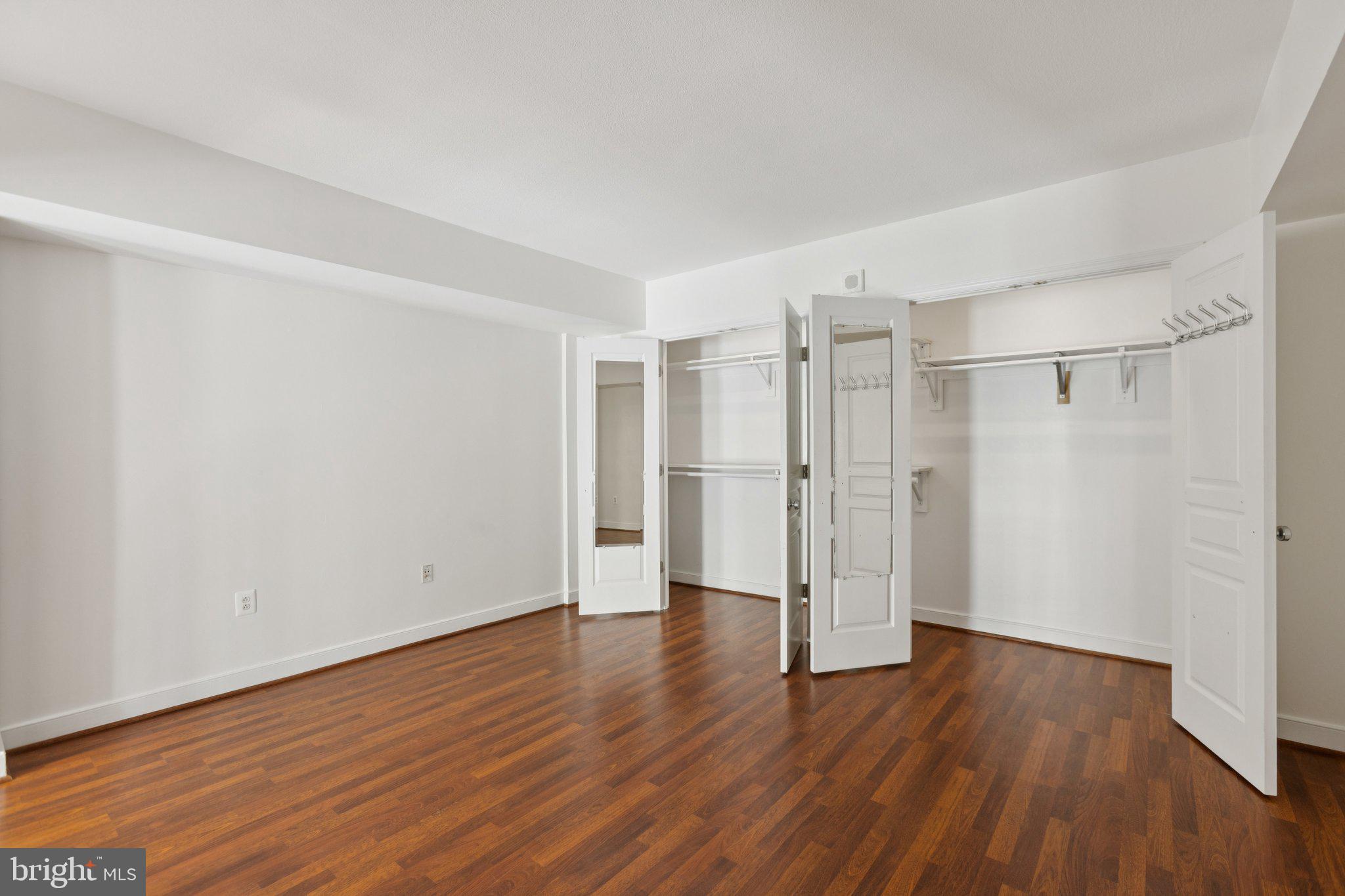 616 E Street Northwest, Unit 217 Washington, DC 20004 - Photo 19 of 73 a view of an empty room with wooden floor