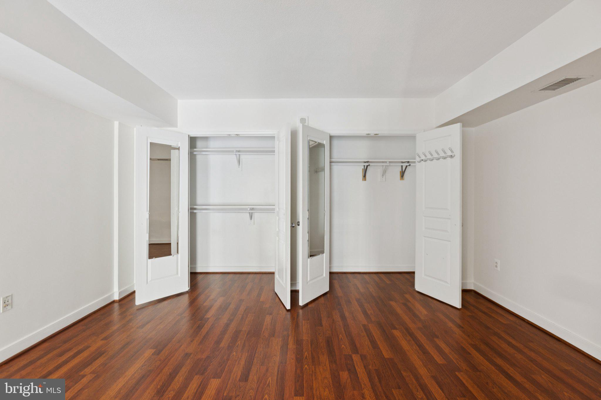 616 E Street Northwest, Unit 217 Washington, DC 20004 - Photo 20 of 73 a view of an empty room with wooden floor