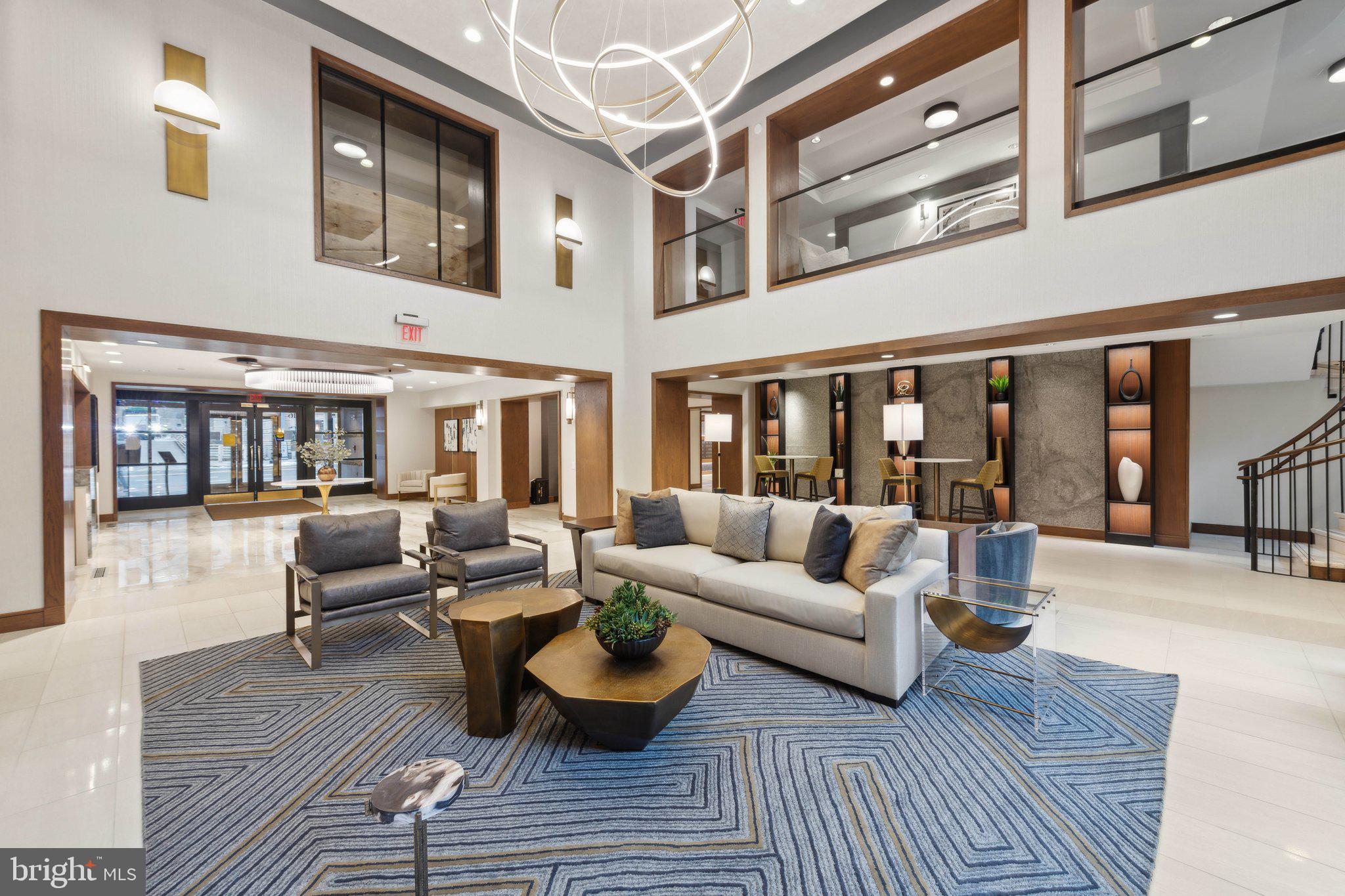 616 E Street Northwest, Unit 217 Washington, DC 20004 - Photo 26 of 73 a living room with furniture and wooden floor