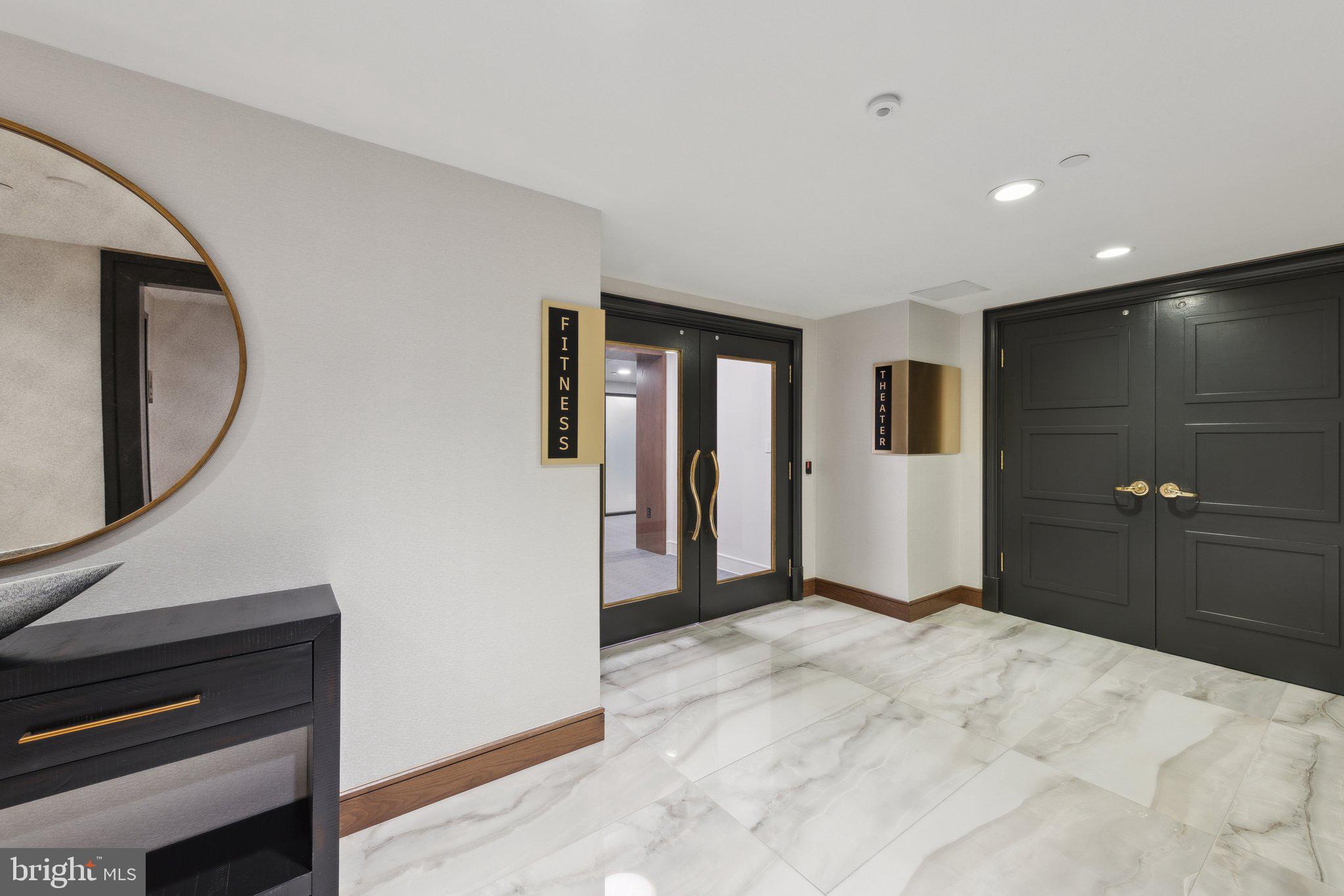 616 E Street Northwest, Unit 217 Washington, DC 20004 - Photo 28 of 73 a view of a livingroom with wooden floor and a ceiling fan