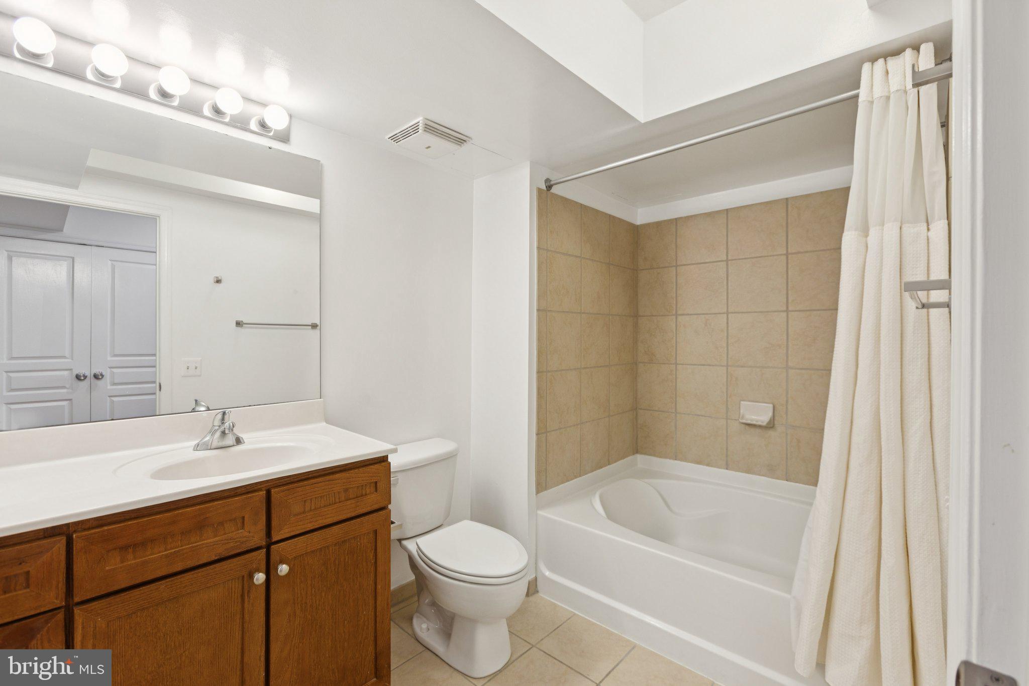 616 E Street Northwest, Unit 217 Washington, DC 20004 - Photo 4 of 73 a bathroom with a sink a toilet and shower